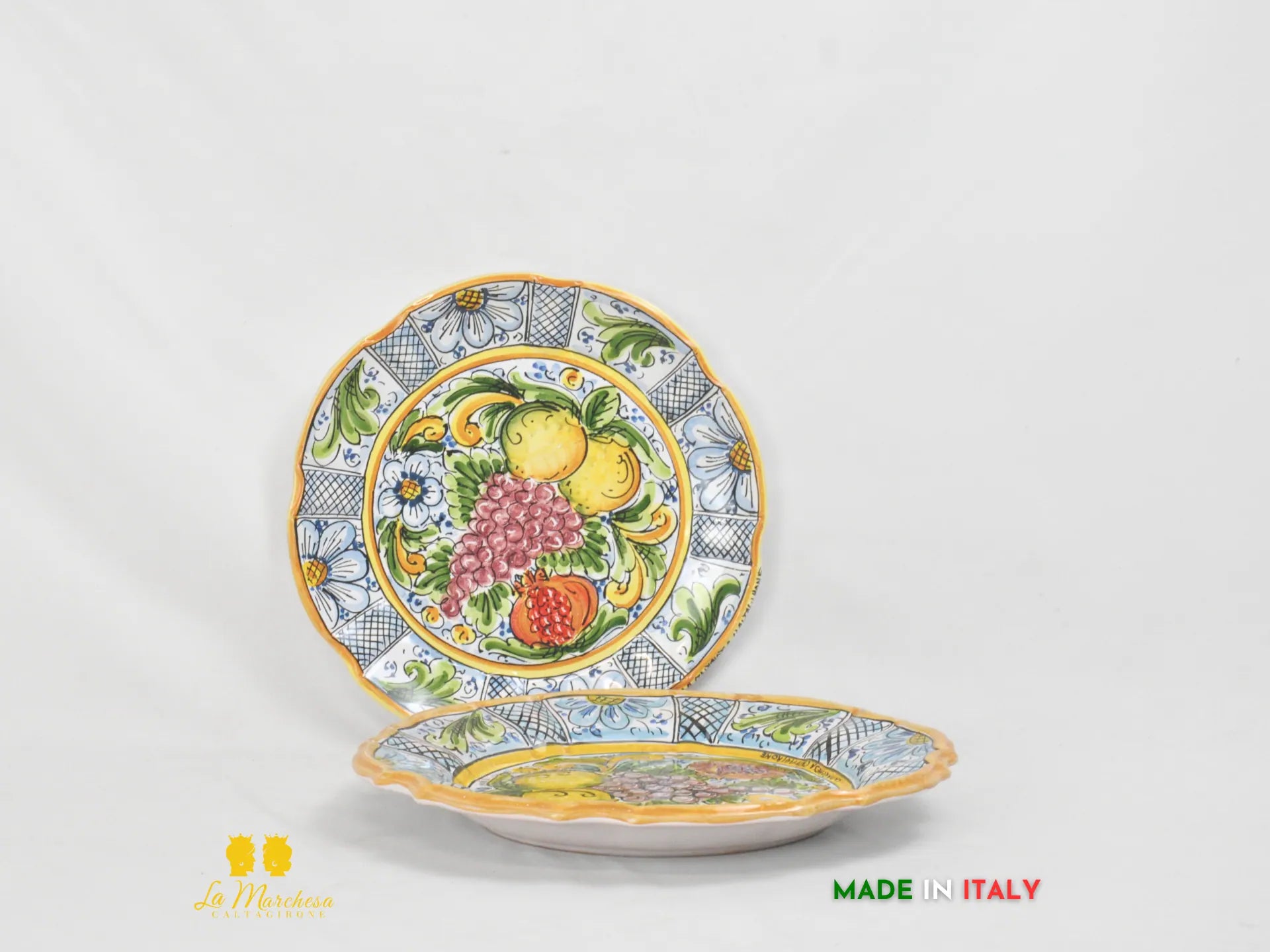 Piatto in Ceramica di Caltagirone ornato frutta bordo fiori