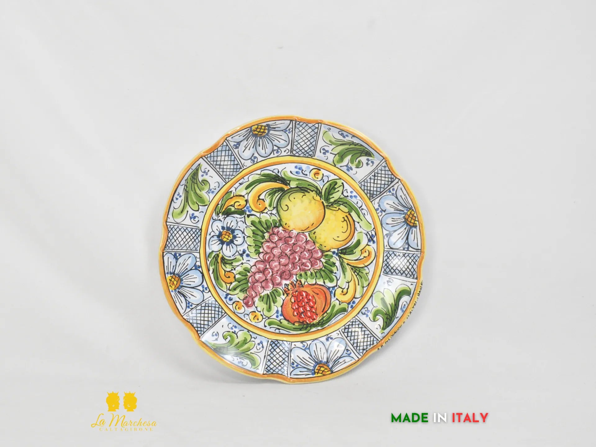 Piatto in Ceramica di Caltagirone ornato frutta bordo fiori